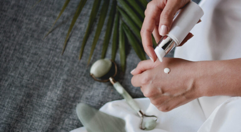 Woman's hands using Fairtrade beauty products