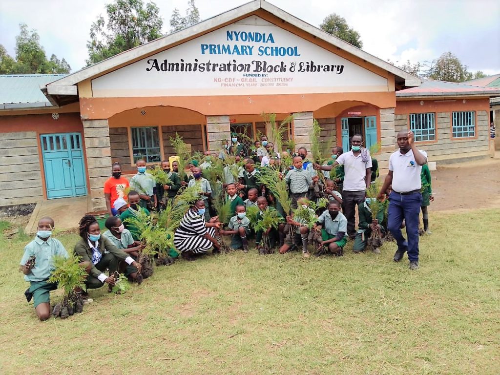 Planting trees to surrounding schools to improve environment conservation at Fairtrade Flower farm Bigot Farms.